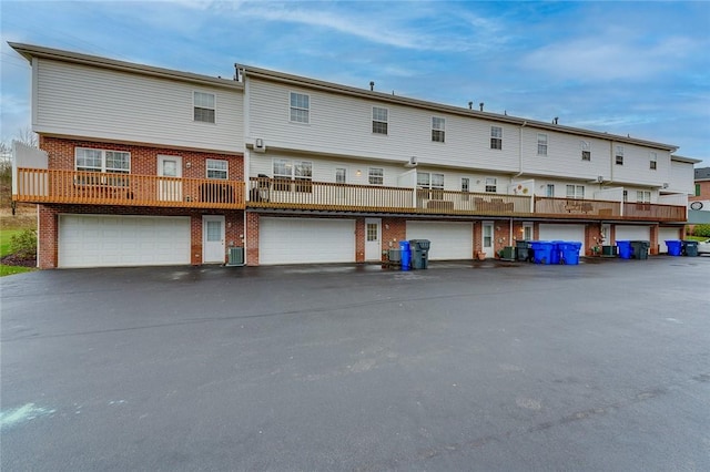 rear view of property featuring central AC unit