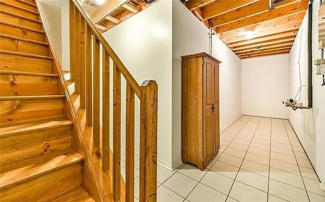 staircase featuring tile patterned floors