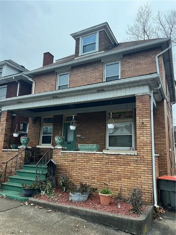 view of front of home featuring covered porch