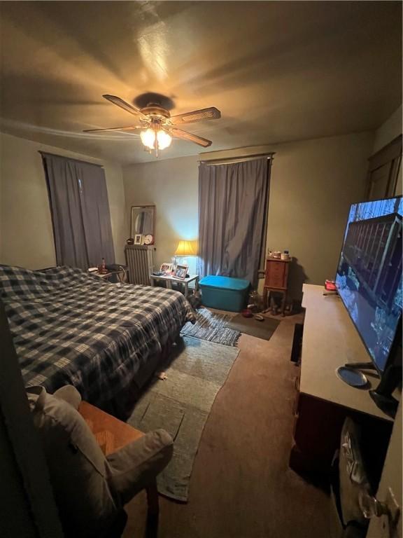 bedroom featuring ceiling fan and carpet floors