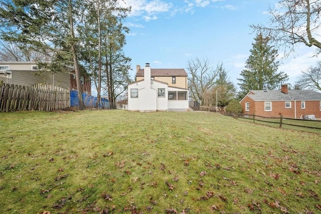 view of yard with a sunroom