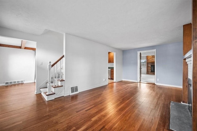 unfurnished living room featuring wood-type flooring