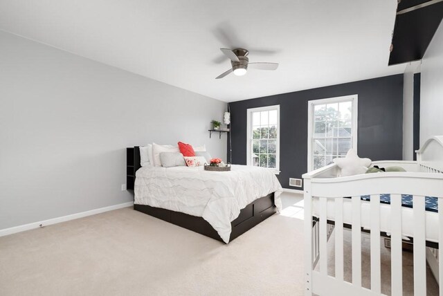 carpeted bedroom featuring ceiling fan