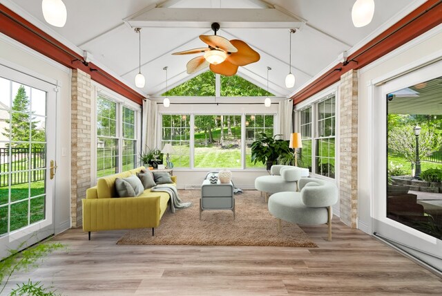 sunroom with vaulted ceiling with beams and ceiling fan