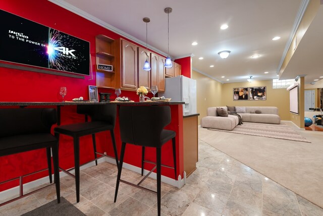 bar featuring pendant lighting, white refrigerator with ice dispenser, and crown molding