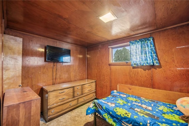 bedroom with wooden walls, carpet, and wood ceiling