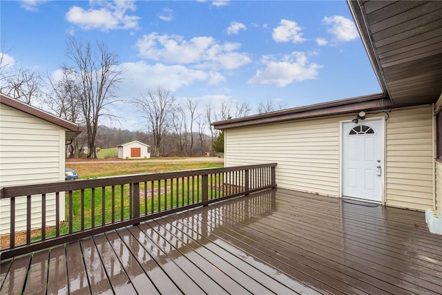 wooden deck featuring a yard