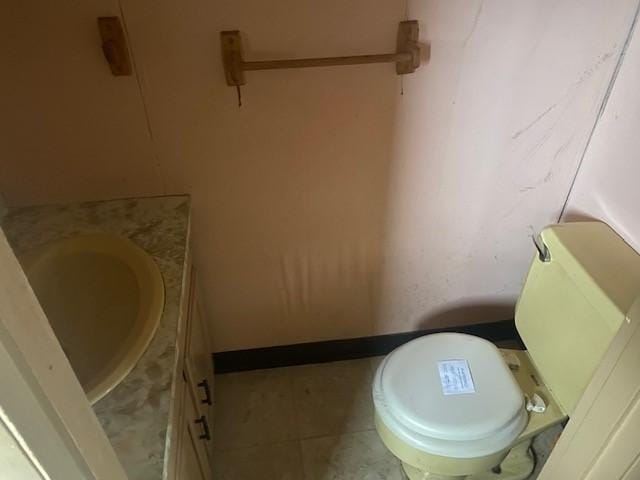 bathroom with tile patterned floors, vanity, and toilet