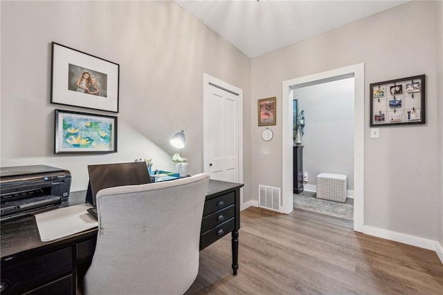 office area with hardwood / wood-style flooring