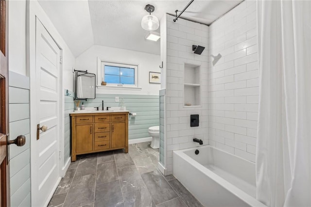 full bathroom with a textured ceiling, vanity, vaulted ceiling, shower / bathtub combination with curtain, and toilet