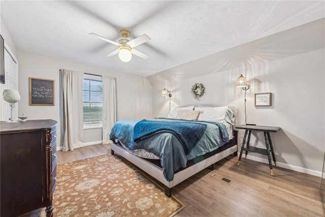 bedroom featuring hardwood / wood-style flooring and ceiling fan