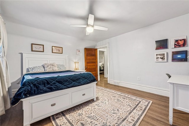 bedroom featuring light wood-type flooring and ceiling fan