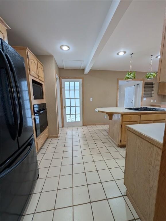 kitchen featuring beam ceiling, a kitchen breakfast bar, decorative light fixtures, light brown cabinetry, and black appliances