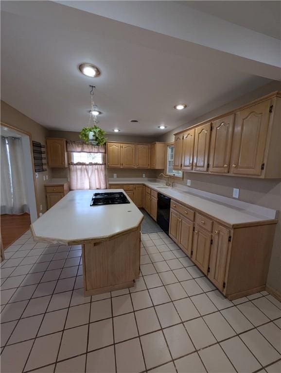 kitchen with sink, a center island, gas cooktop, black dishwasher, and light brown cabinetry