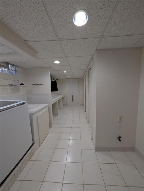 washroom with light tile patterned floors and washer / dryer