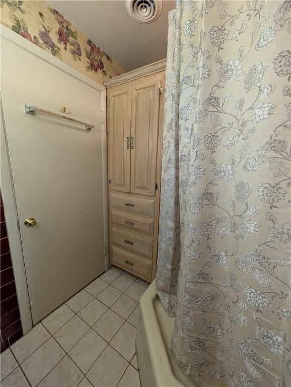 bathroom with tile patterned flooring