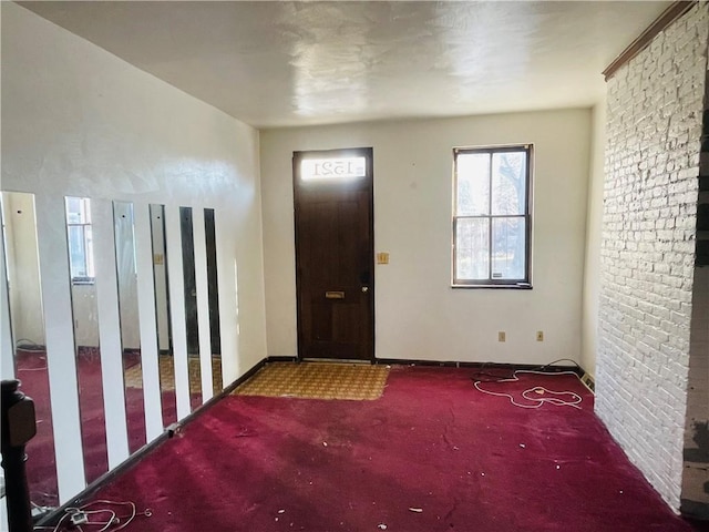 view of carpeted entrance foyer