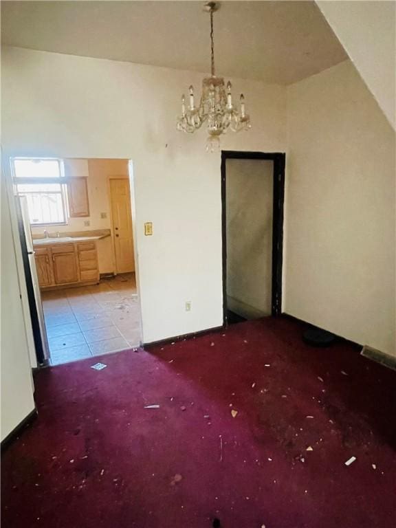 unfurnished dining area with an inviting chandelier