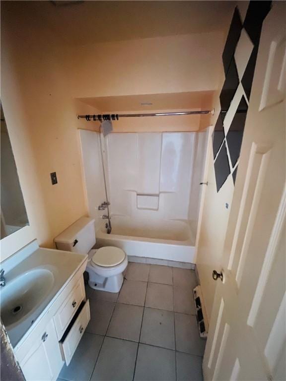 full bathroom with washtub / shower combination, tile patterned flooring, vanity, and toilet