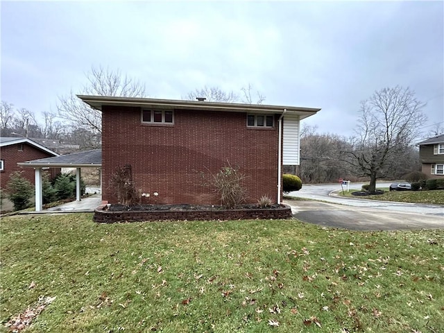 view of property exterior with a yard