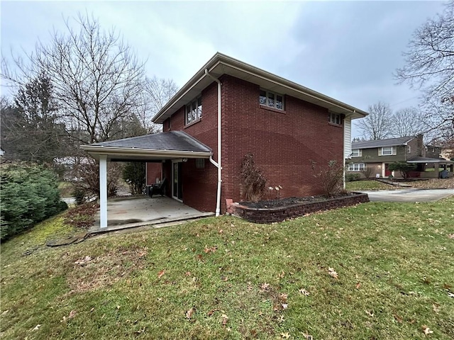 view of home's exterior featuring a carport and a lawn