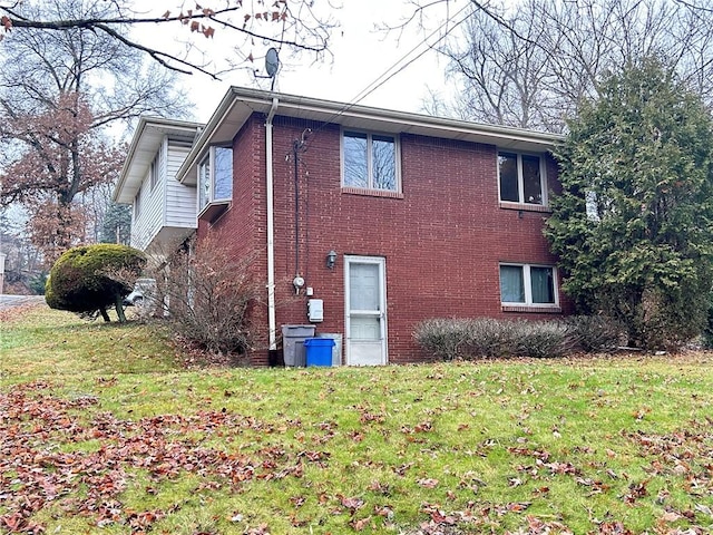 view of home's exterior featuring a yard