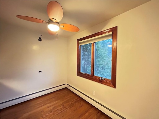 unfurnished room featuring hardwood / wood-style floors, baseboard heating, and ceiling fan