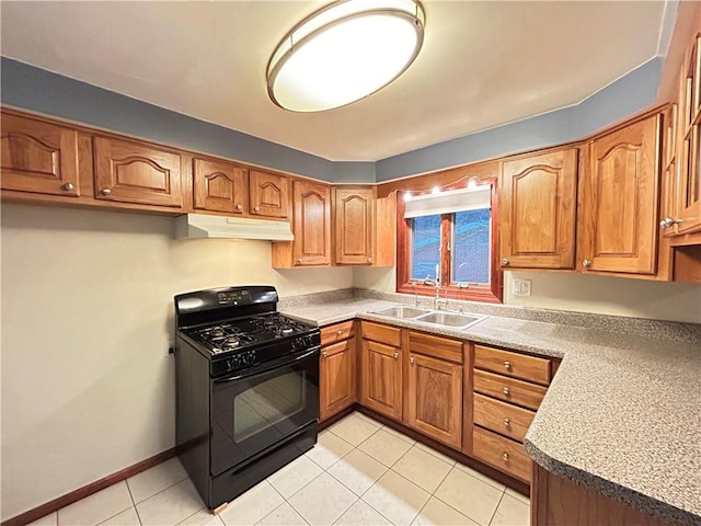 kitchen with black gas range, light tile patterned floors, and sink