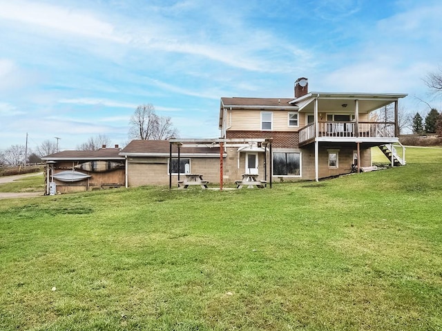 back of property with a pergola, a yard, and a deck