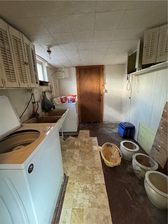 laundry area with washing machine and clothes dryer