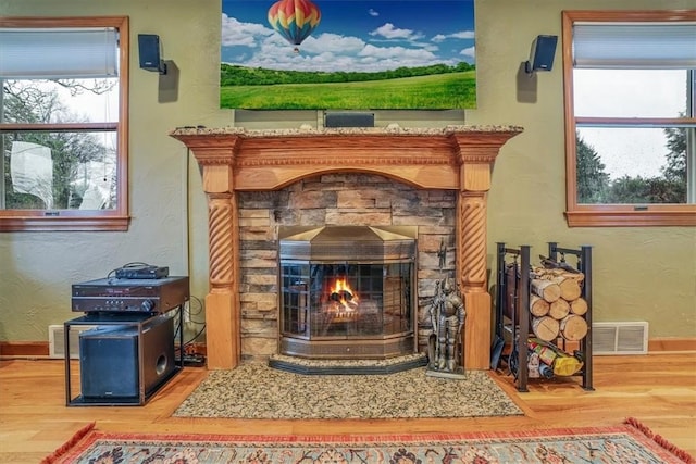 interior details with a fireplace and hardwood / wood-style floors