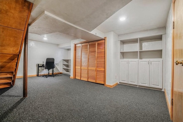 interior space with dark colored carpet