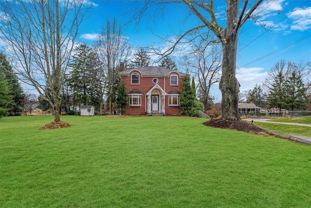 view of front of house featuring a shed and a front yard