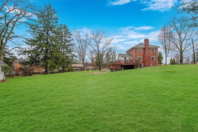 view of yard with a wooden deck