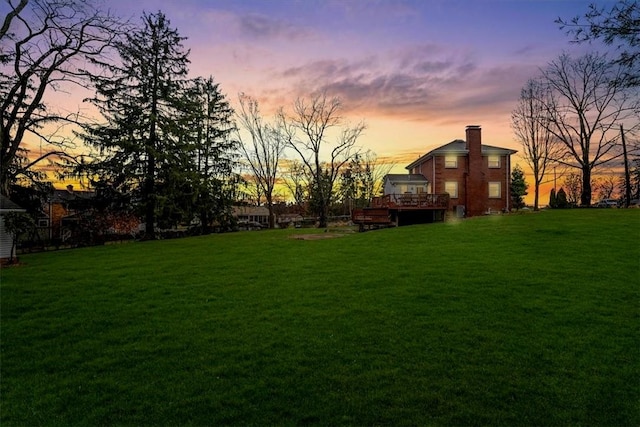 view of yard at dusk