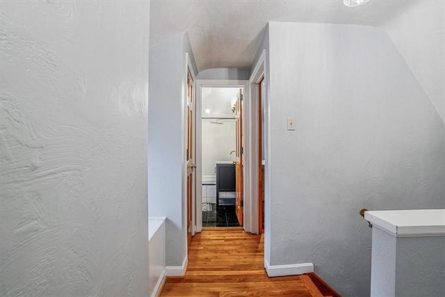 hallway with light wood-type flooring