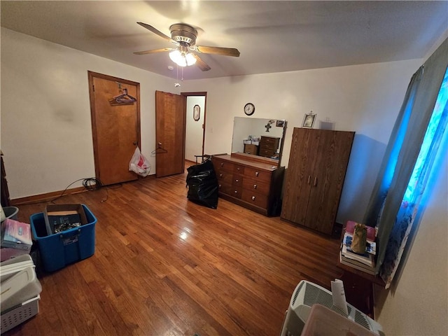 interior space with hardwood / wood-style flooring and ceiling fan