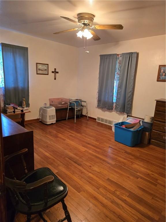 interior space featuring ceiling fan and wood-type flooring