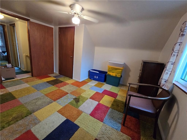 additional living space featuring carpet flooring and ceiling fan