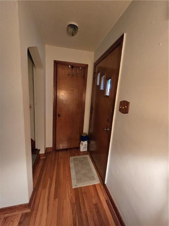 hallway featuring hardwood / wood-style flooring