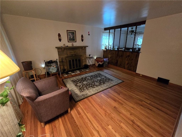 living room featuring a fireplace and hardwood / wood-style flooring