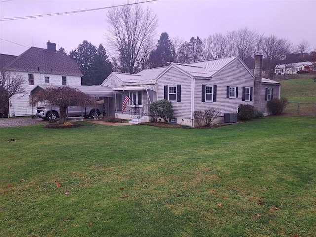 back house at dusk featuring a yard and cooling unit