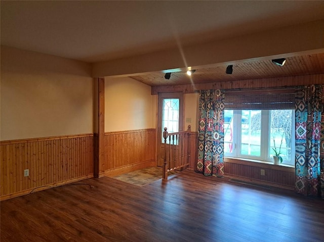 empty room featuring dark hardwood / wood-style flooring