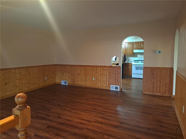 empty room with dark wood-type flooring