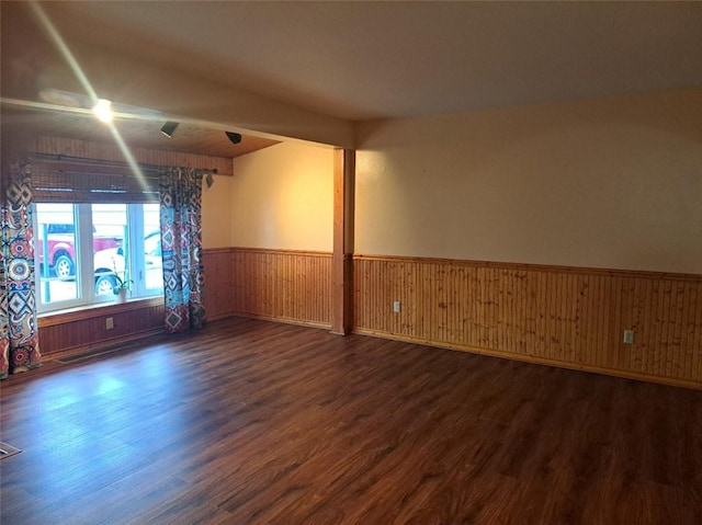 empty room featuring dark hardwood / wood-style flooring