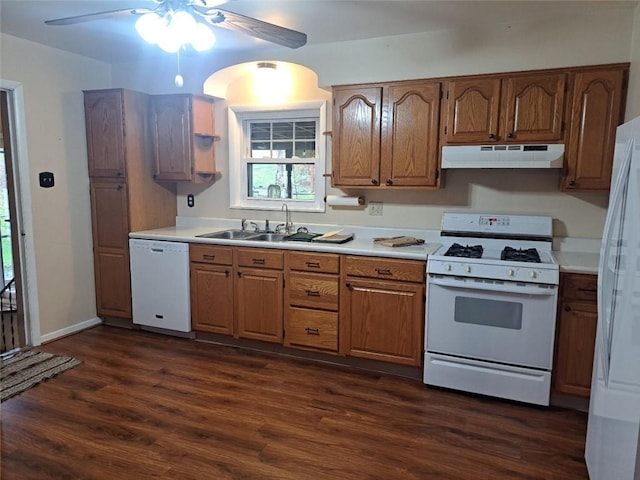 kitchen with ceiling fan, dark hardwood / wood-style flooring, white appliances, and sink