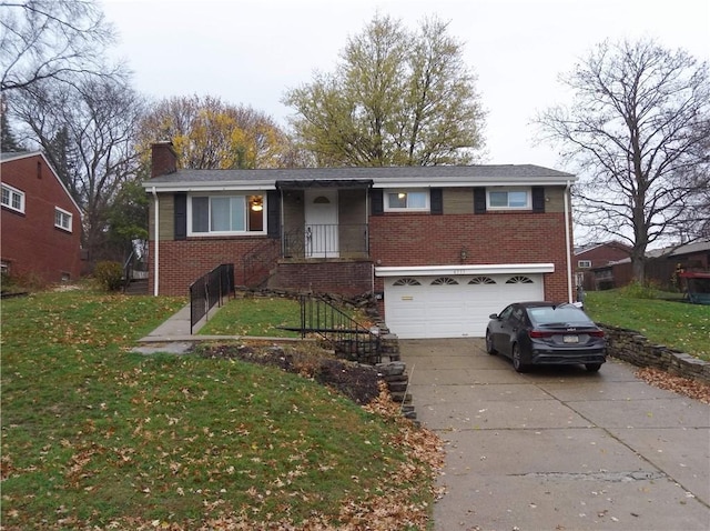 view of front of property with a front yard and a garage