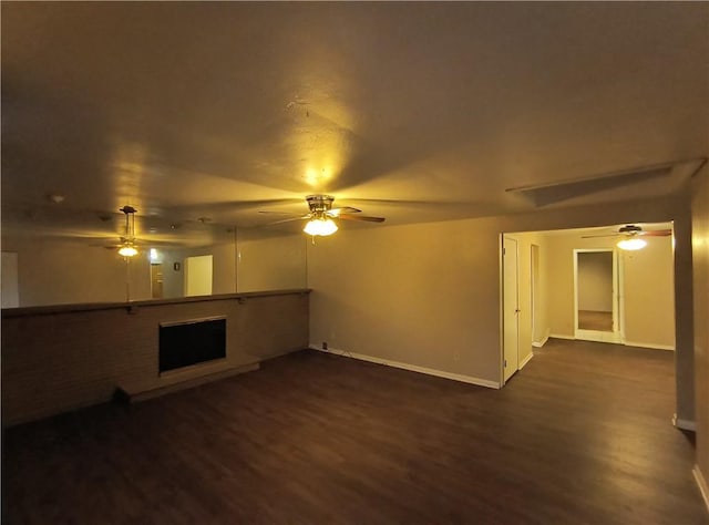 unfurnished living room with dark hardwood / wood-style floors