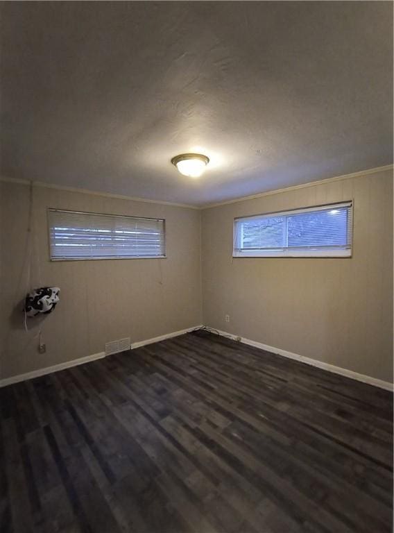 spare room featuring dark hardwood / wood-style floors