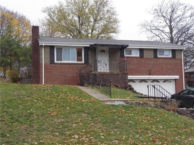 view of front facade with a front yard and a garage